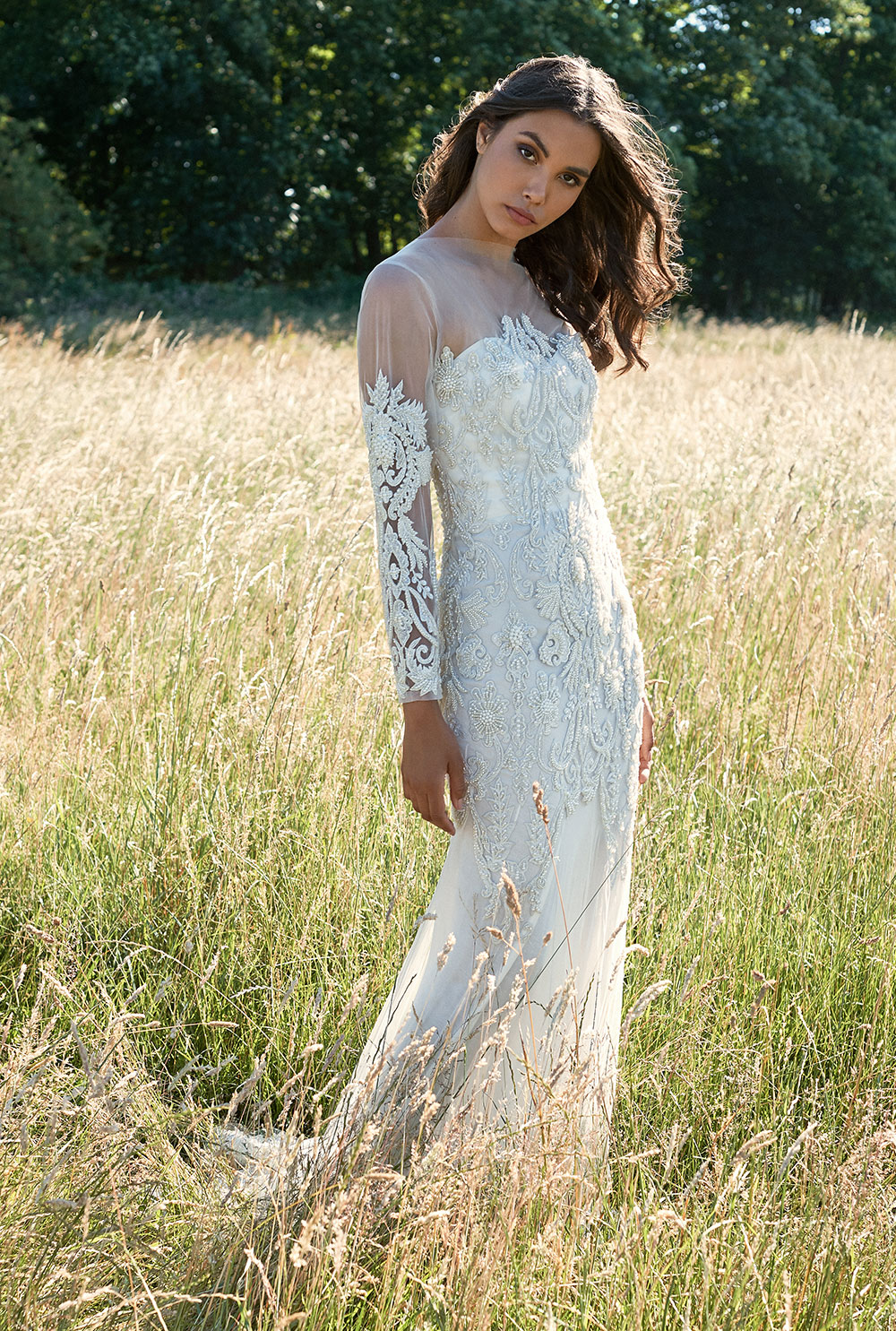 Alternative white wedding dress with long sleeves and embroidery